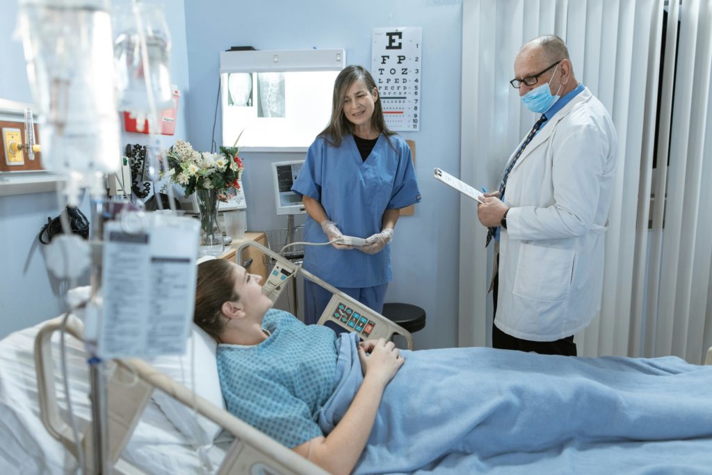 Doctor and Nurse looking at critical patient care