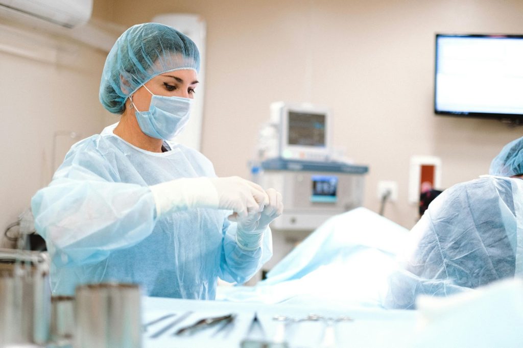 A nurse providing excellent health care during a medical procedure.