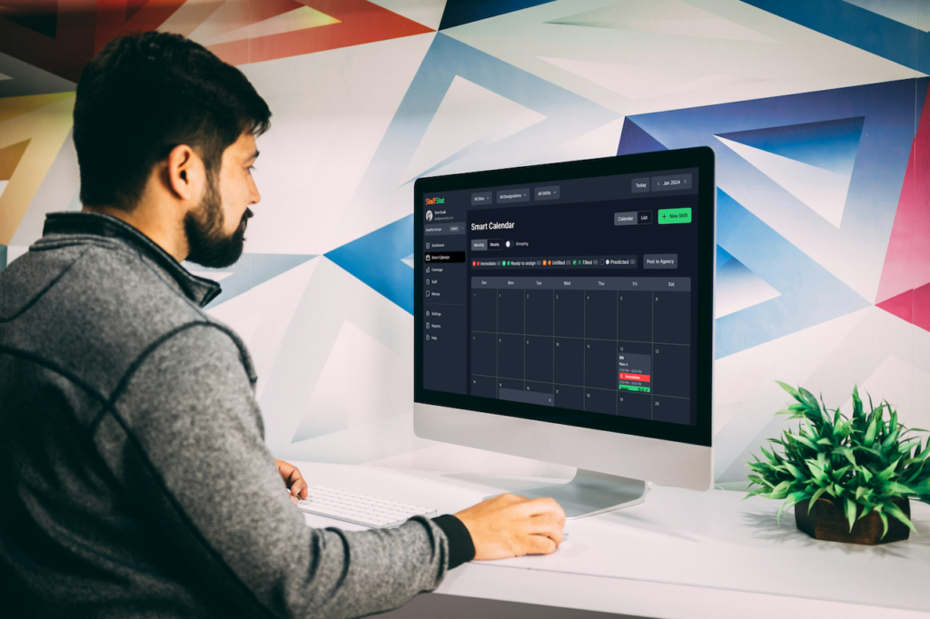 Employee using the StaffStat Active Scheduling software for management of operations.
